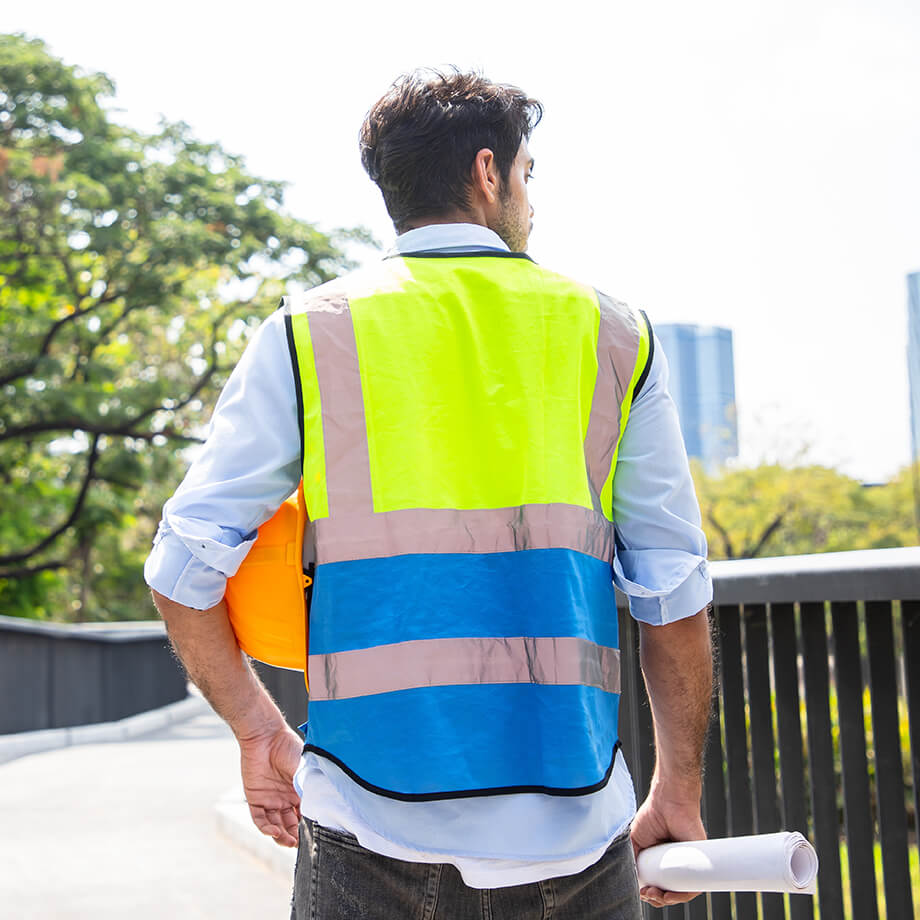 a landscape crew leader in a construction vest